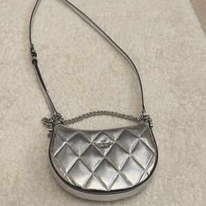 Kate Spade Carey Metallic Zip Top Crossbody bag in silver quilted leather